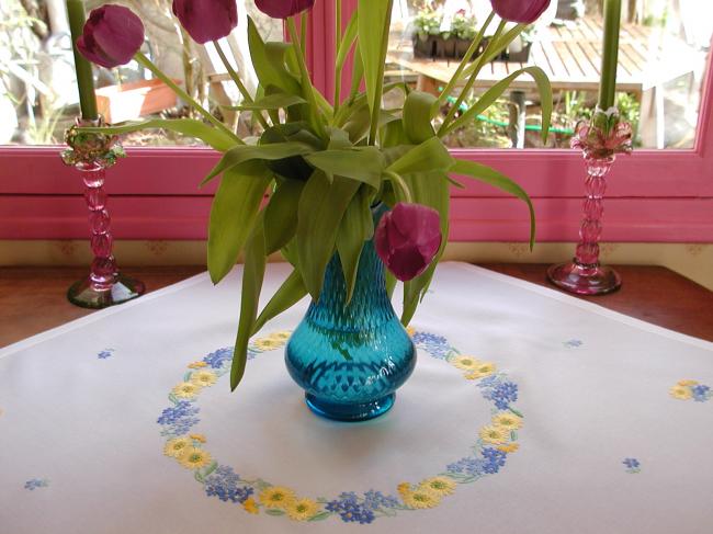 Lovely tablecloth with hand-embroidered crown of yellow and blue flowers