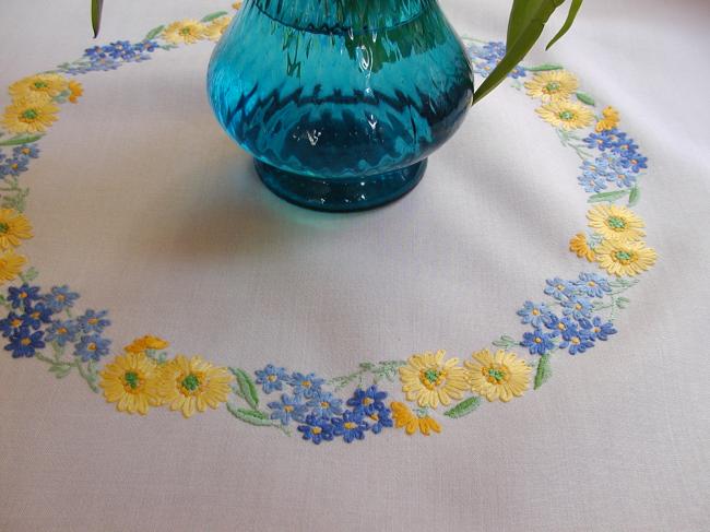 Lovely tablecloth with hand-embroidered crown of yellow and blue flowers