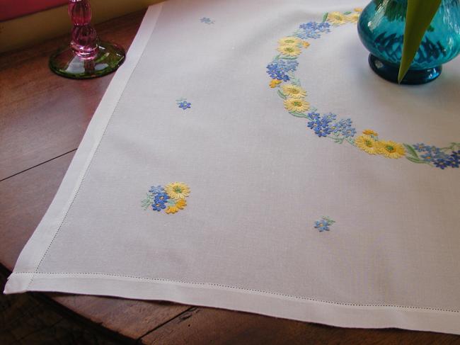 Lovely tablecloth with hand-embroidered crown of yellow and blue flowers