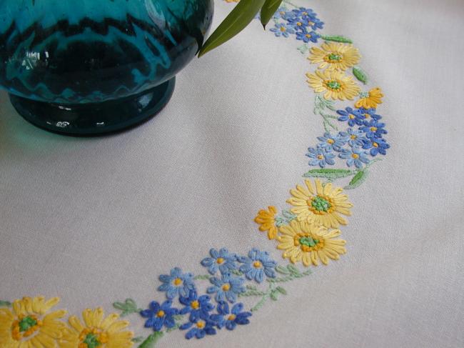 Lovely tablecloth with hand-embroidered crown of yellow and blue flowers