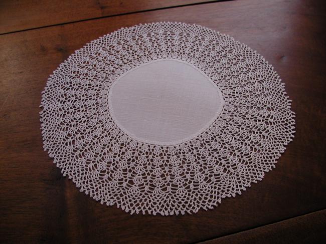 Sweet round doily with very fine crochet lace