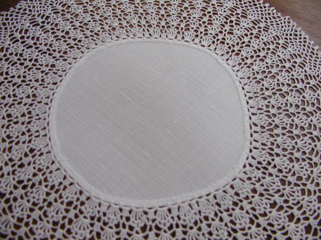 Sweet round doily with very fine crochet lace