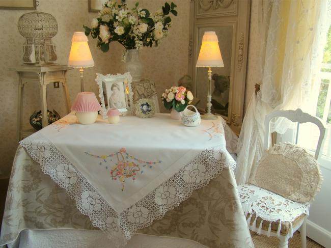 Really pretty tablecloth with hand-embroidered baskets of flowers and lace