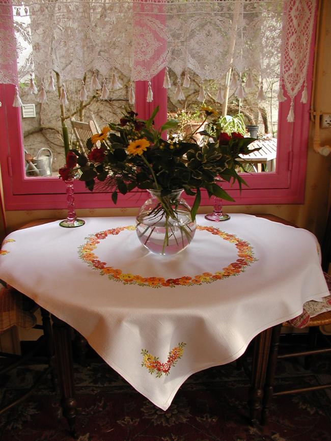 Gorgeous tablecloth with hand-embroidered crown of orange flowers