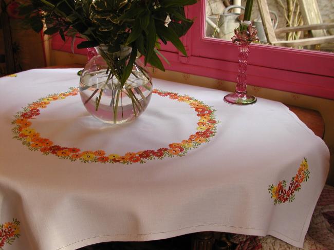 Gorgeous tablecloth with hand-embroidered crown of orange flowers