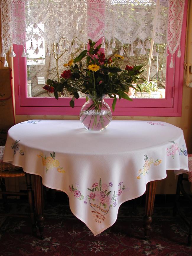 So sweet tablcloth with hand-embroidered vases of flowers