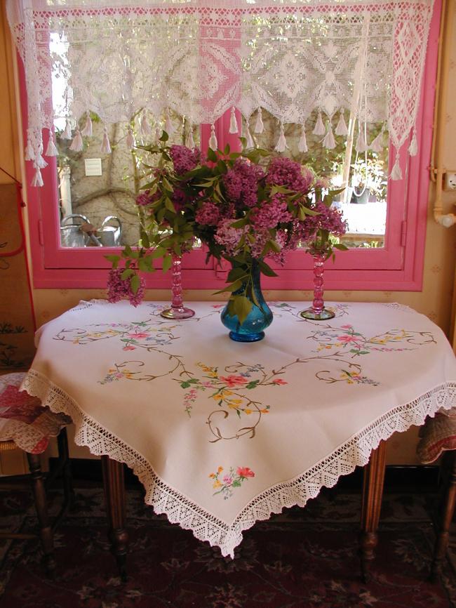 Striking tablecloth with hand-embroidered summer flowers and hand-done lace