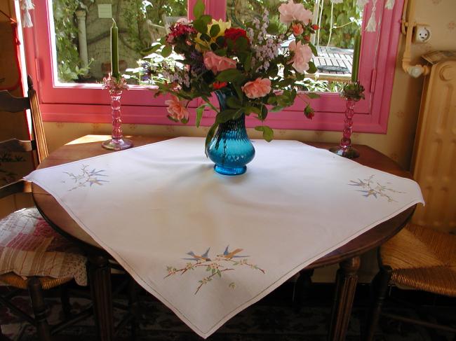 Very pretty tablecloth with birds in a blooming apple-tree