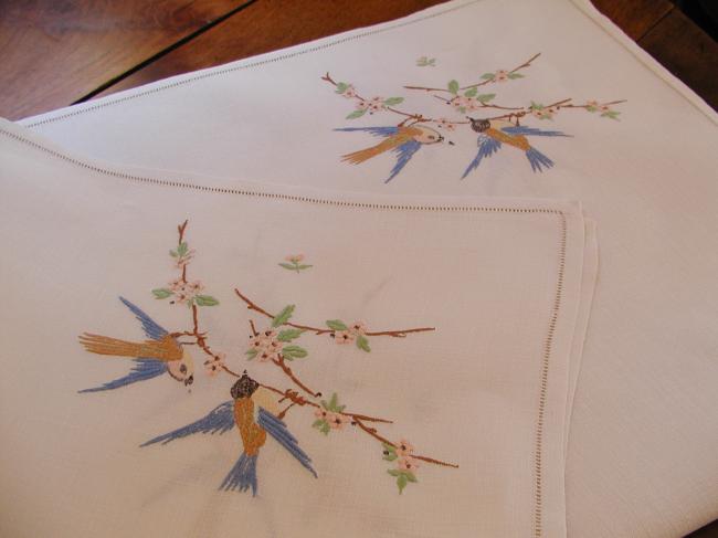 Very pretty tablecloth with birds in a blooming apple-tree