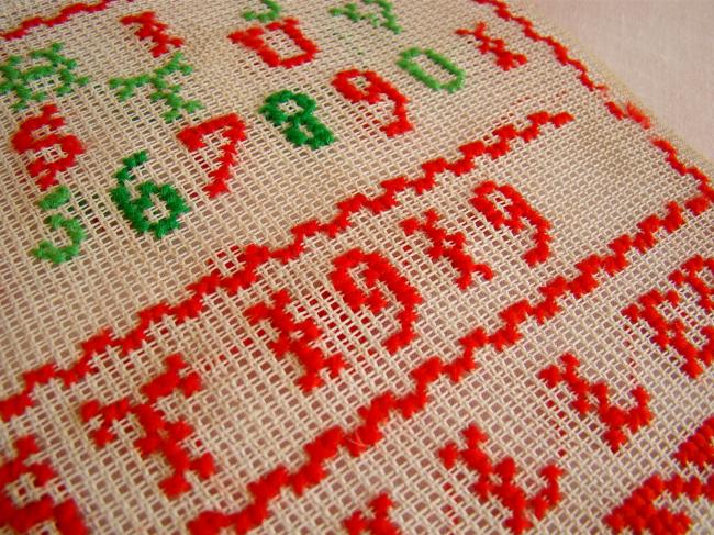 Lovely sampler made in red and green cross stitches, circa 1919, at Ramberviller