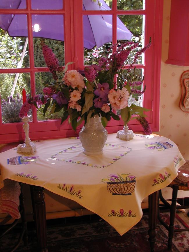 Adorable tablecloth with vibrant coloured and  hand-embroidered crocus