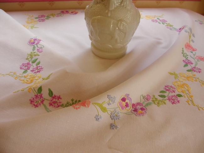 Breathtaking tablecloth with hand-embroidered garland of spring flowers