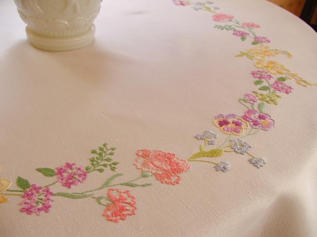 Breathtaking tablecloth with hand-embroidered garland of spring flowers