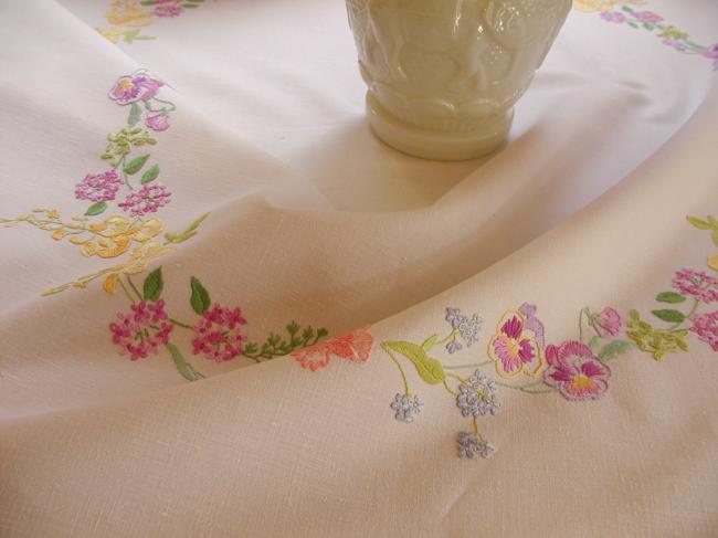 Breathtaking tablecloth with hand-embroidered garland of spring flowers