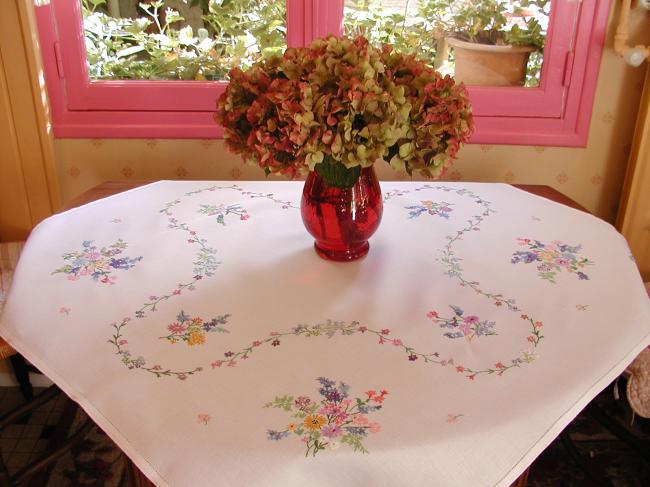 Breathtaking tablecloth with hand-embroidered  bouquets of spring flowers