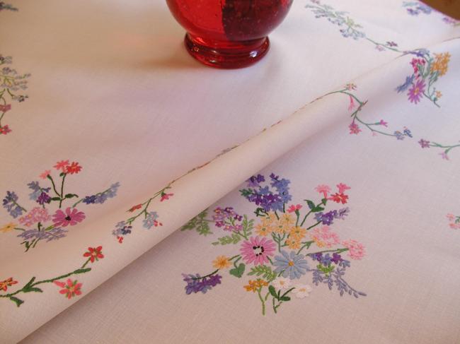 Breathtaking tablecloth with hand-embroidered  bouquets of spring flowers