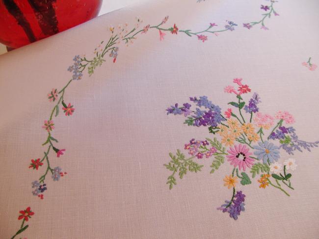 Breathtaking tablecloth with hand-embroidered  bouquets of spring flowers