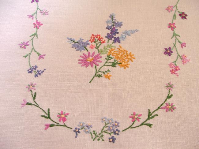 Breathtaking tablecloth with hand-embroidered  bouquets of spring flowers