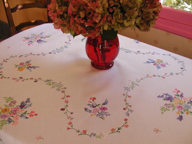 Breathtaking tablecloth with hand-embroidered  bouquets of spring flowers