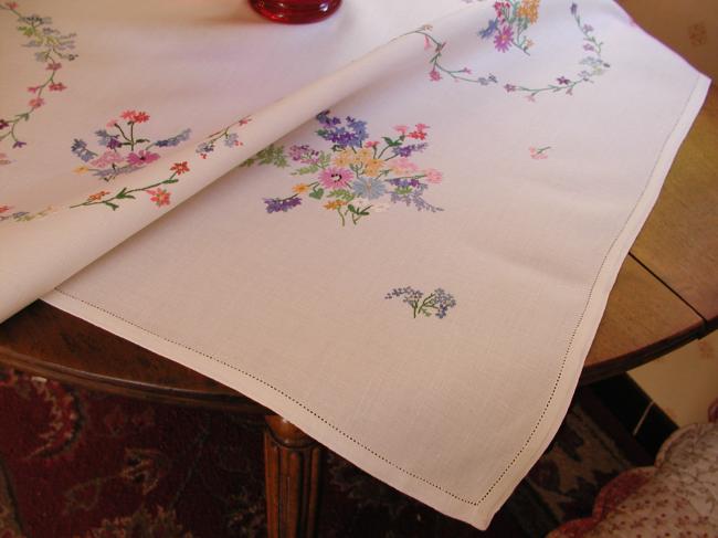 Breathtaking tablecloth with hand-embroidered  bouquets of spring flowers