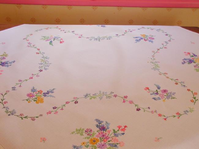 Breathtaking tablecloth with hand-embroidered  bouquets of spring flowers