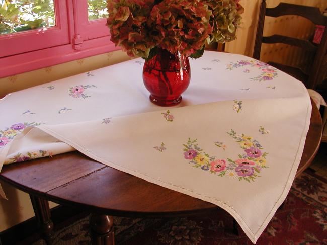 Breathtaking tablecloth with hand-embroidered  bouquets of spring flowers