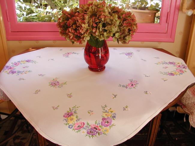 Breathtaking tablecloth with hand-embroidered  bouquets of spring flowers