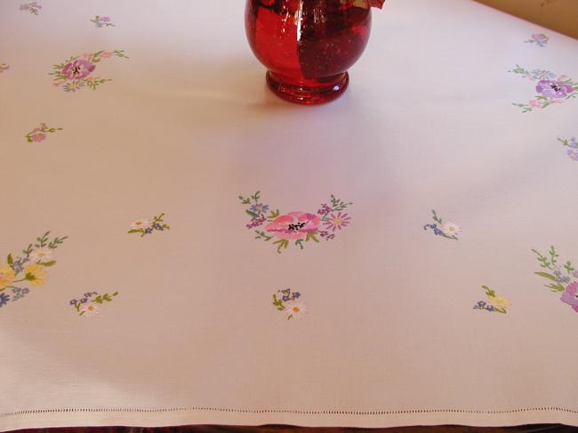 Breathtaking tablecloth with hand-embroidered  bouquets of spring flowers