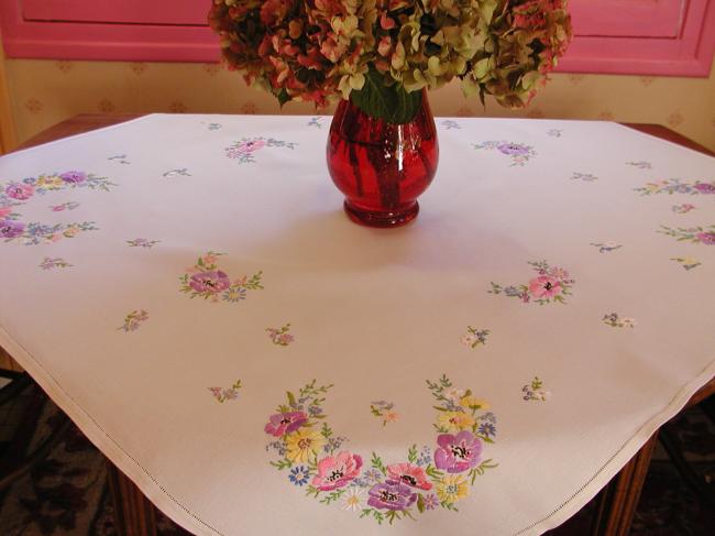 Breathtaking tablecloth with hand-embroidered  bouquets of spring flowers