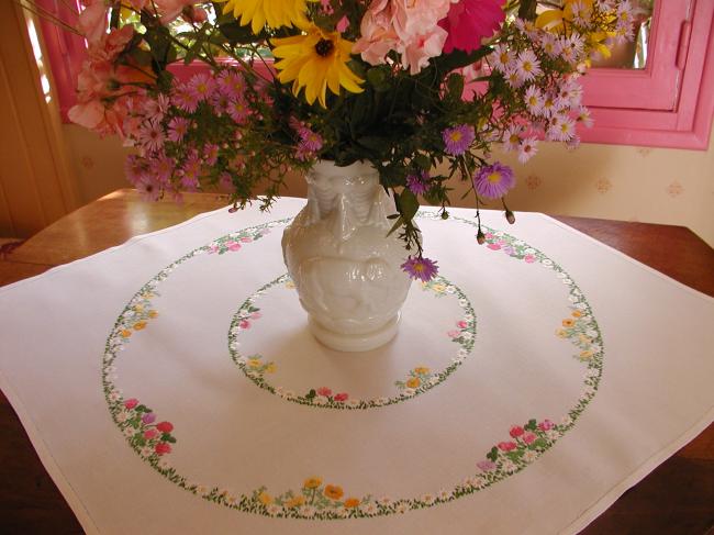 Really romantic tablecloth with hand-embroidered crowns of summer flowers