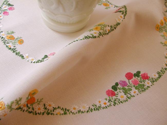 Really romantic tablecloth with hand-embroidered crowns of summer flowers