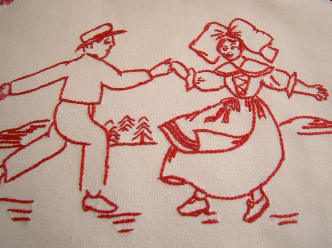 Adorable napperon avec une broderie rouge d'un couple de danseurs alsaciens