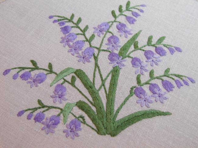 Breathtaking tablecloth with hand-embroidered blue bells and primula