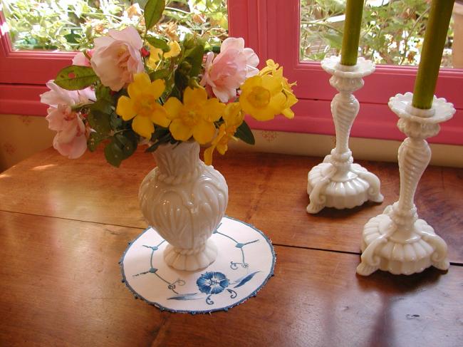 Such a pretty oval doily with blue embroidery