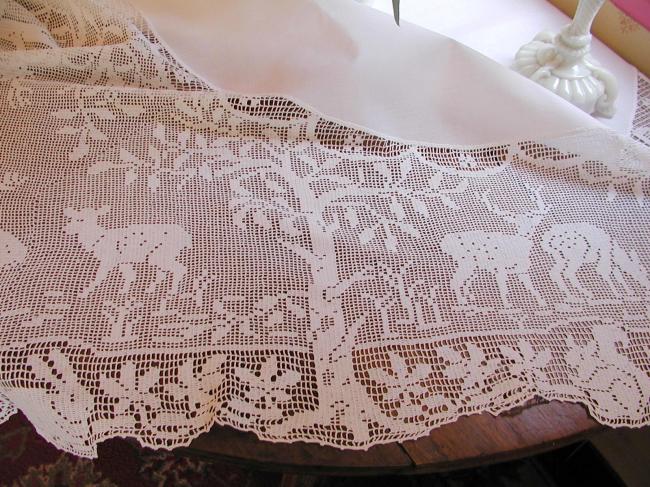 Striking tablecloth with huge crochet lace representing life of forest 1900