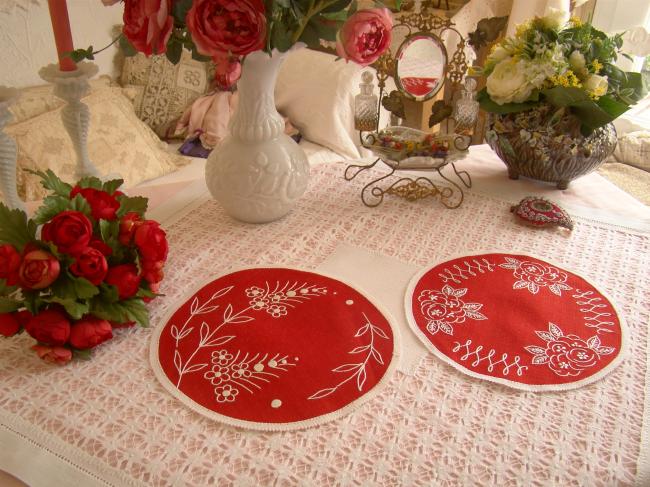 2 lovely red round doilies with hand-embroired flowers.