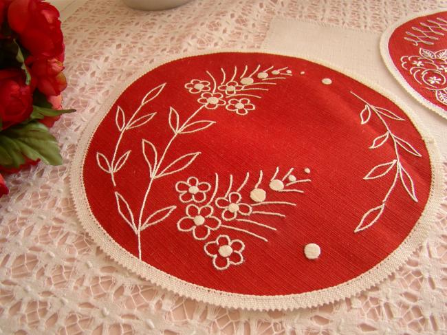 2 lovely red round doilies with hand-embroired flowers.