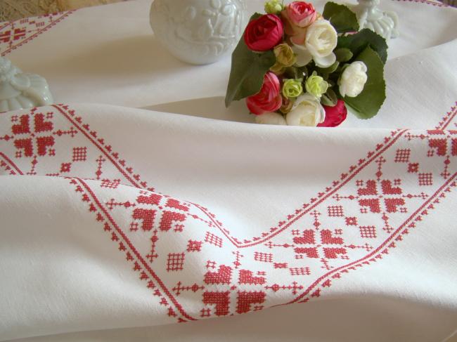 Stunning white linen tablecloth with hand-embroidered cross stitch border