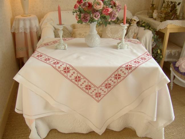 Stunning white linen tablecloth with hand-embroidered cross stitch border