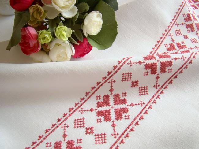 Stunning white linen tablecloth with hand-embroidered cross stitch border