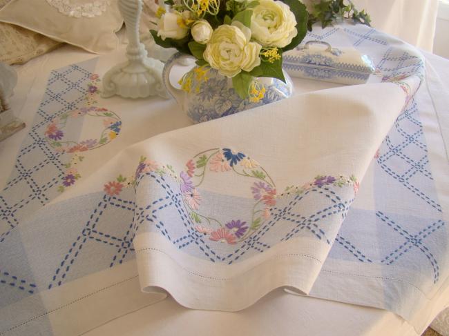 Sweet  white and blue linen tablecloth with hand-embroidered flowers border