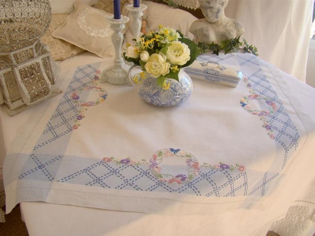 Sweet  white and blue linen tablecloth with hand-embroidered flowers border