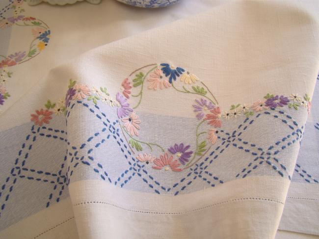 Sweet  white and blue linen tablecloth with hand-embroidered flowers border