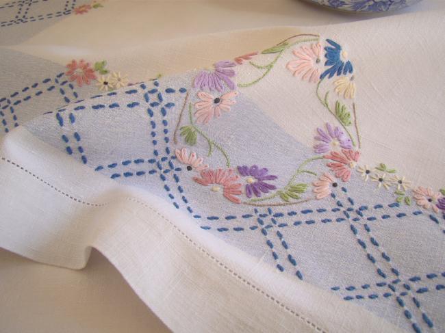 Sweet  white and blue linen tablecloth with hand-embroidered flowers border