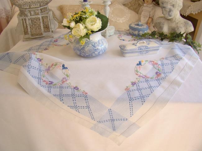 Sweet  white and blue linen tablecloth with hand-embroidered flowers border