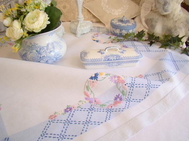 Sweet  white and blue linen tablecloth with hand-embroidered flowers border