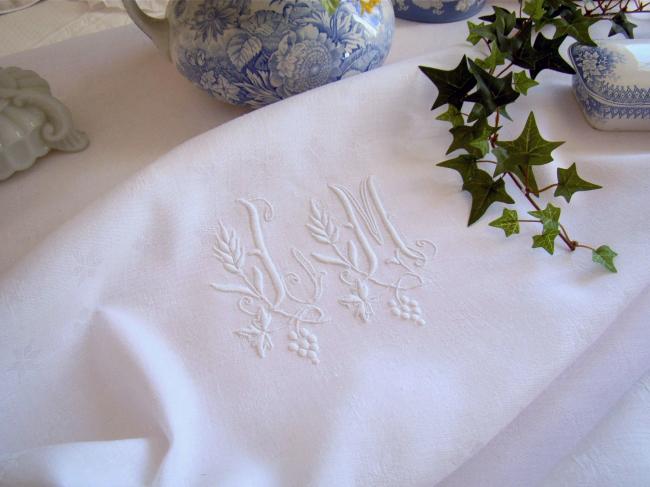 Elegant damask linen tablecloth with hand-embroidered monogram JM