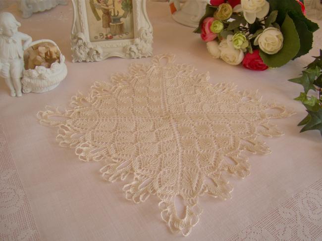 Lovely doily in very fine hand- knitted lace