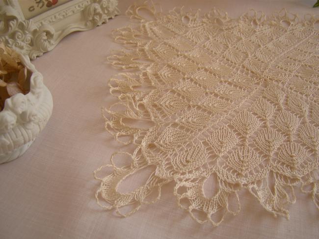 Lovely doily in very fine hand- knitted lace