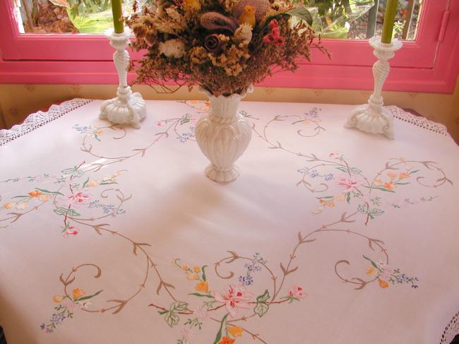 Really breathtaking tablecloth with hand-embroidered flowers and lace edging